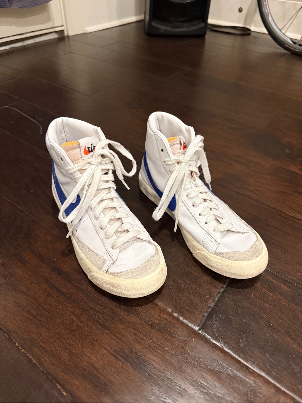 Nike White High-Top Sneakers with Blue Swoosh